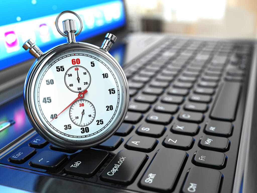 Stopwatch On Laptop Keyboard.